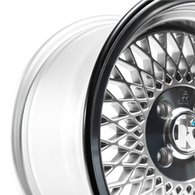 Load image into Gallery viewer, Black RIMFINITY continuous rubber wheel protector on a bare, chrome alloy wheel
